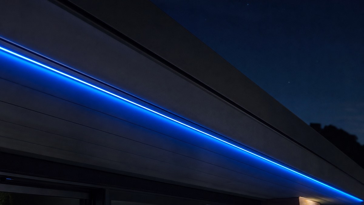 Close-up of side-glow fiber optic cable mounted under the fascia of a modern roofline glowing as a smooth continuous line of blue light